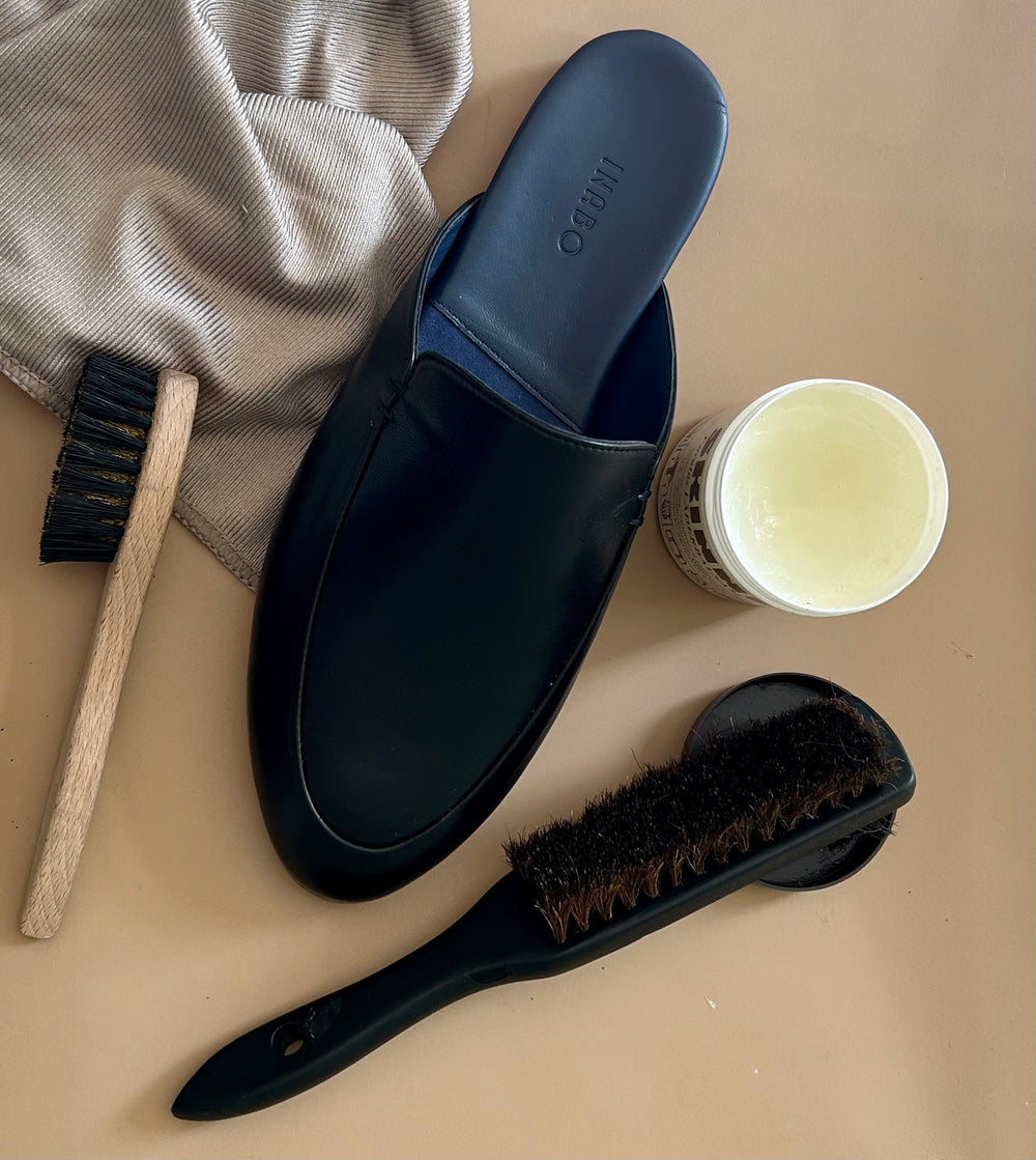 Inabo House slipper together with shoe brushes and shoe cream