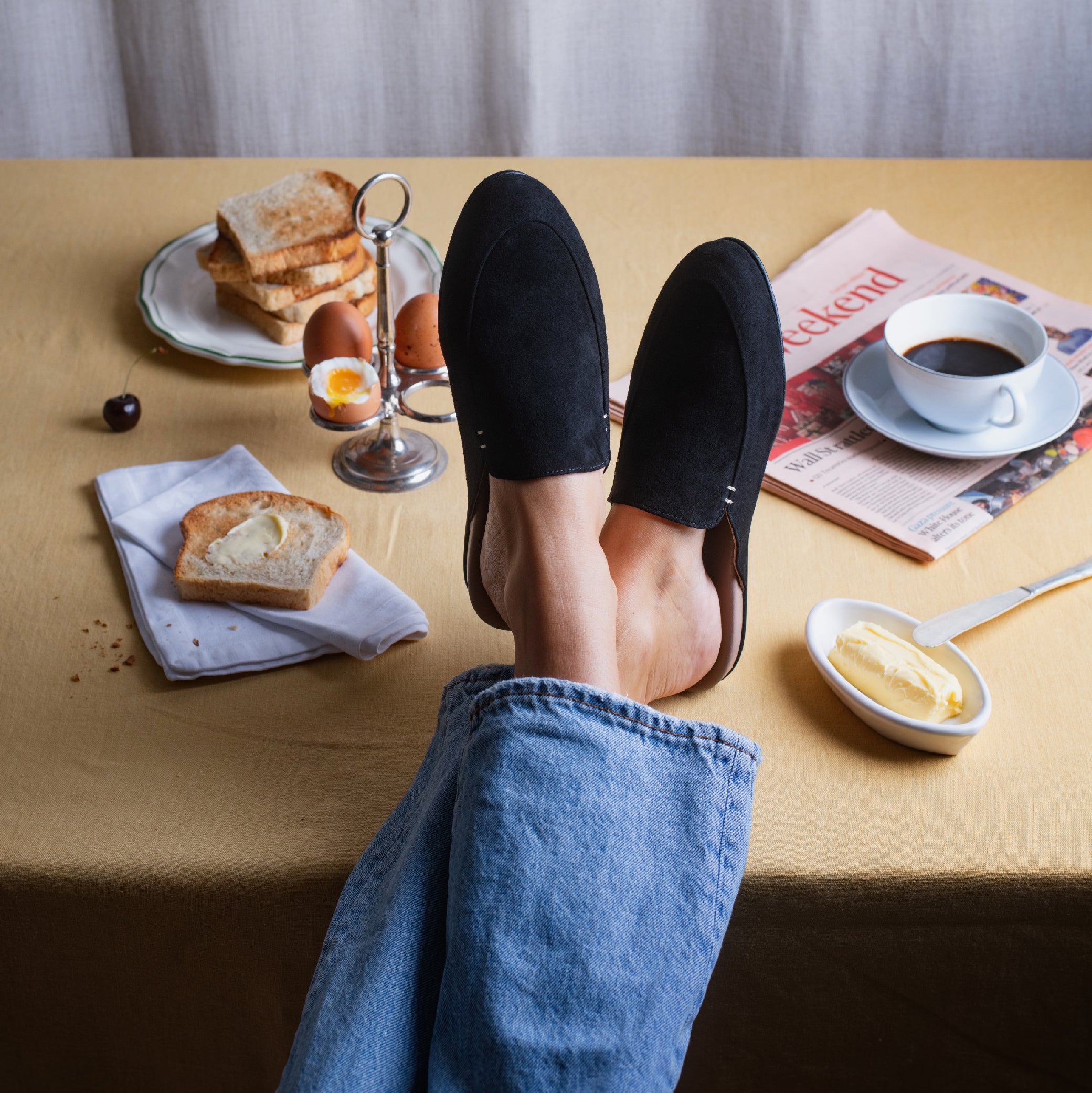 Women's slippers on a breakfast table
