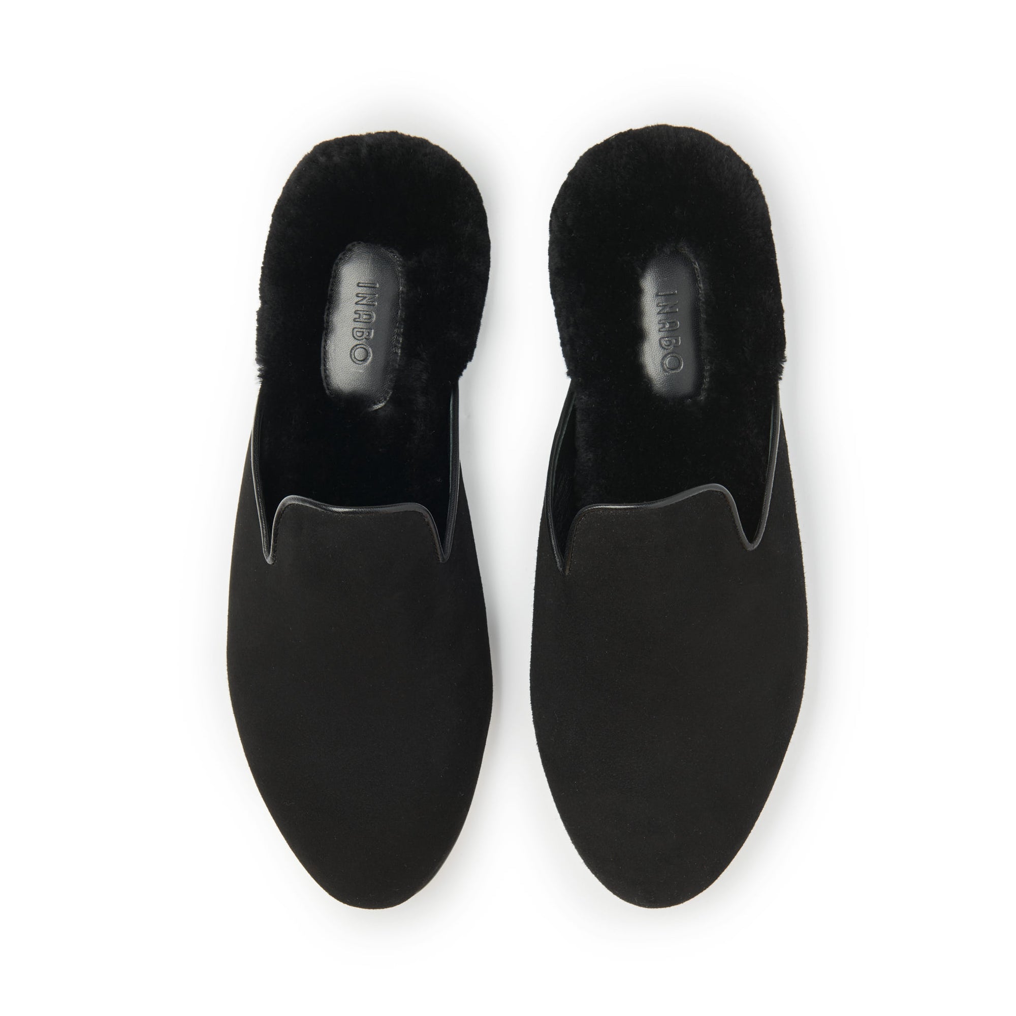 A pair of Inabo Men's Fritz Slipper in Black Suede and Shearling